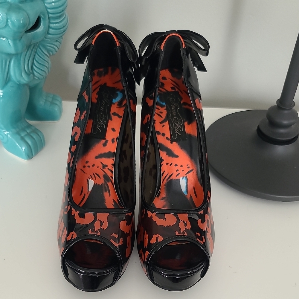 IRON FIST black and red cheetah print heels with a fishnet style heel with bow!